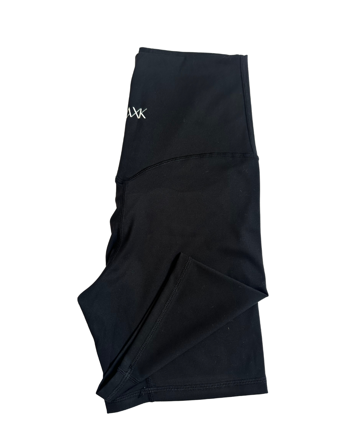 Flat lay of premium black maternity bike shorts with a supportive high waist and AXK logo detail, displayed on a white background. Premium maternity athletic and activewear by AXK.