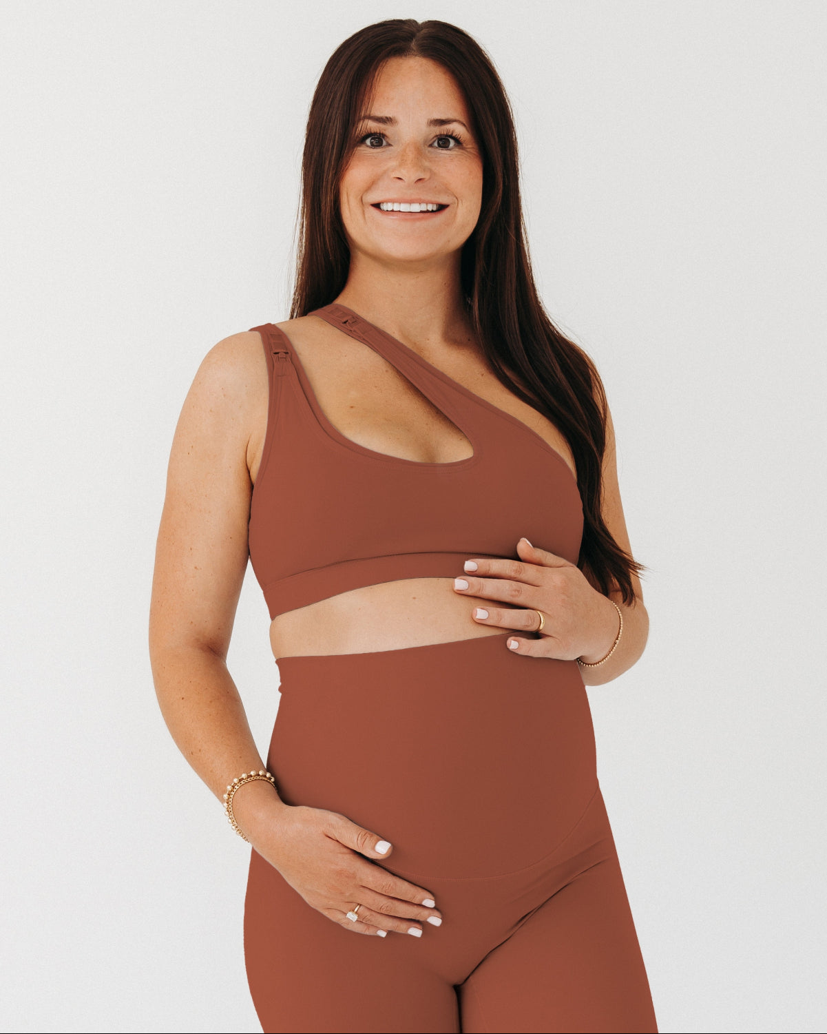 Brown AXK one-shoulder maternity and nursing sports bra. Paired with matching high-waist leggings, this premium maternity workout set is available in plus size, tall friendly, and petite friendly sizing. Premium maternity activewear and athleisure by AXK.